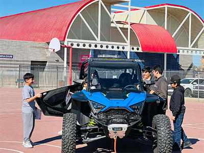 Students looking at ATV