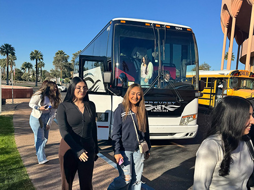 Students exiting busses at the SILC ASU Language Fair