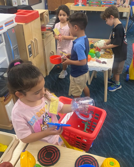 Group of young students playing in the classroom