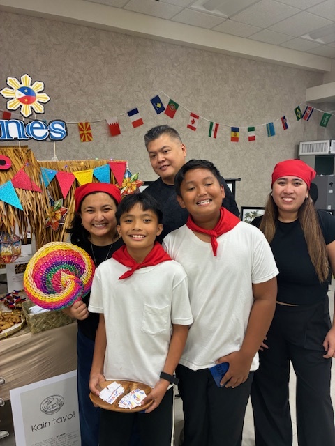 Group of adults and students celebrating Multicultural Event at North Park Elementary