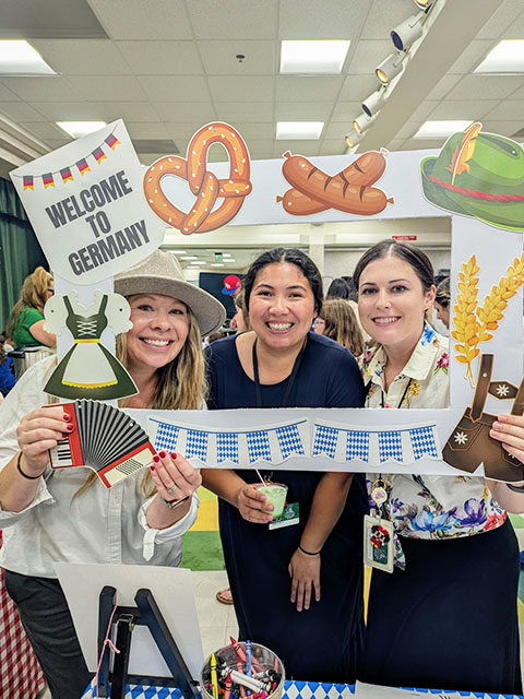 Three happy women celebrating Multicultural Event at North Park Elementary