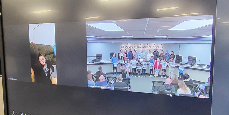 Governing Board of the Saugus Union School District recognized one student from each of the 14 elementary school sites with the Perseverance Award and one student shown virtually on a computer monitor