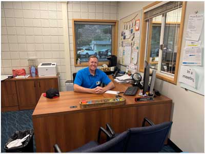 Councilmember Jason Gibbs at the Principal's desk