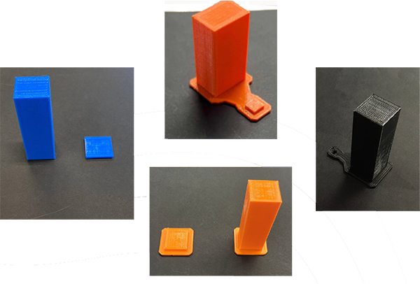 Blue, orange, and black objects printed on a 3D printer