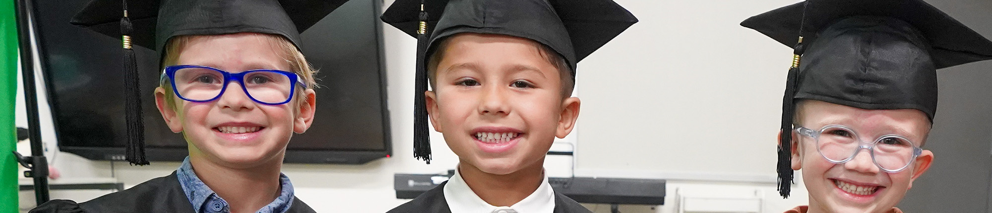 Three kindergarten students during graduation