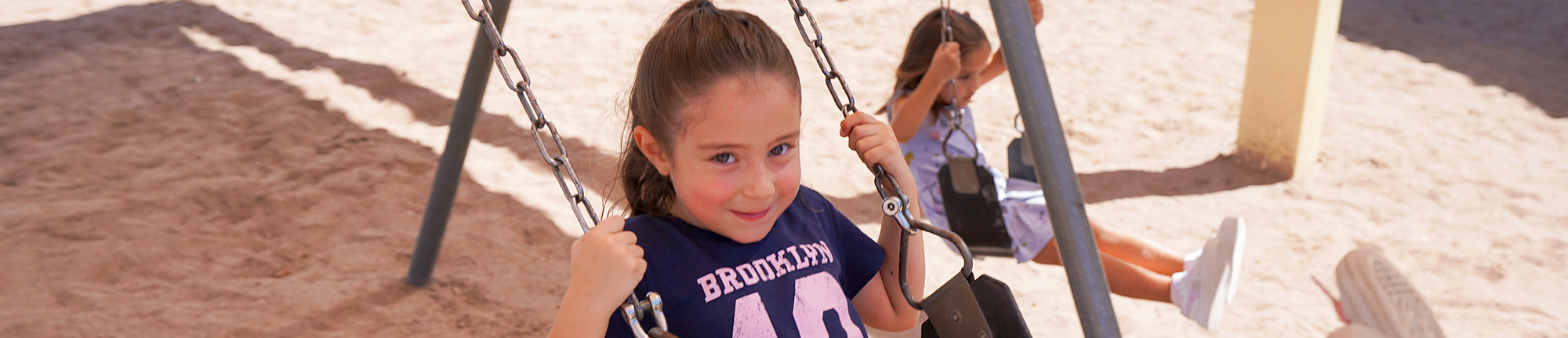 School girl on a swing