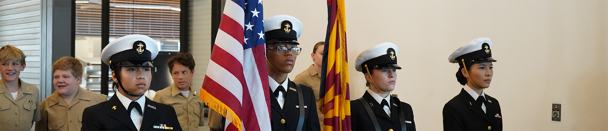 EHS Navy JROTC students holding flags