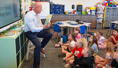 Dr. Perry Berry reading to elementary students