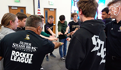 Group of ESports students in a huddle