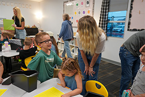 Teacher talking with student in the classroom