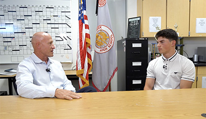 QCUSD Superintendent Perry Berry speaking with Keegan Roque