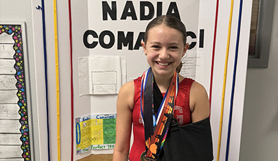FBP student in front of her Nadia Comăneci display