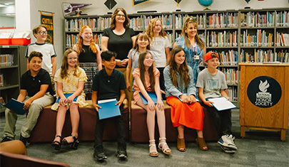 Smiling students in the library