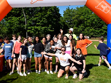 Group of students and staff participating in a running event