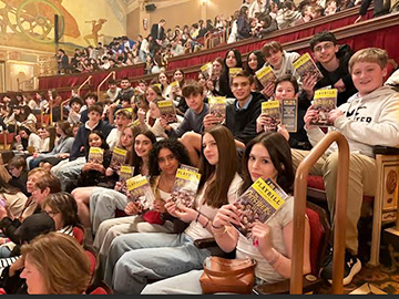 Group of students attending a theatre production