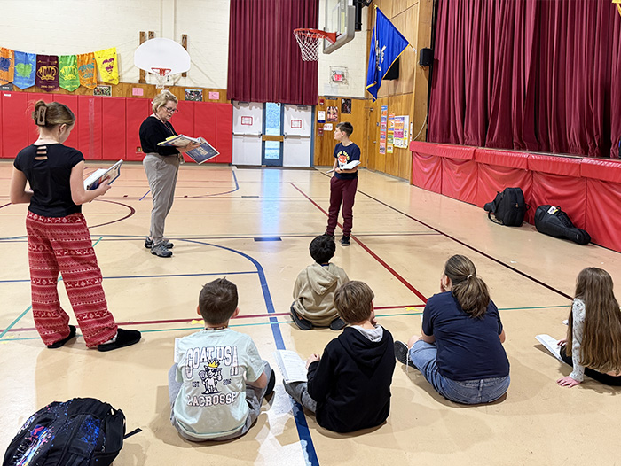 Students rehearsing in the gym