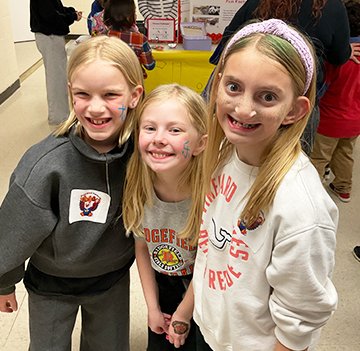 Three happy girls posing for a picture