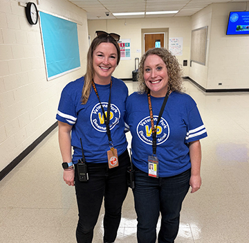Two happy staff members