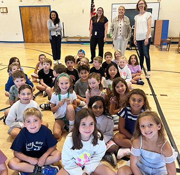 Group of happy students and staff