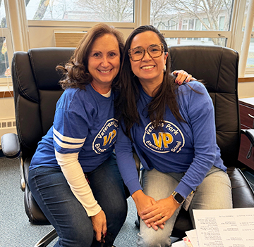 Two happy staff members in an office