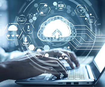 Hands typing on laptop with cloud image