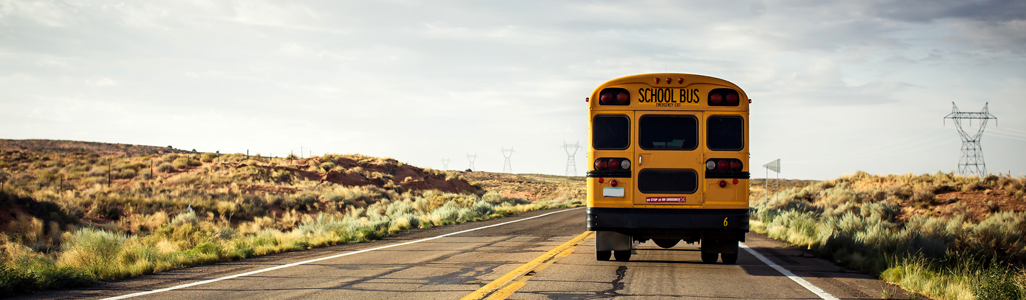 Back of school bus on a rural road Back of school bus on a rural road