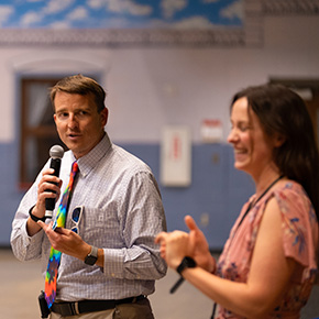 two staff members at an event