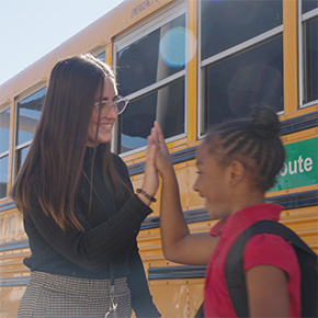 teacher giving student a high five