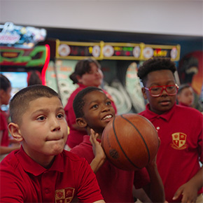 boys shooting basketballs