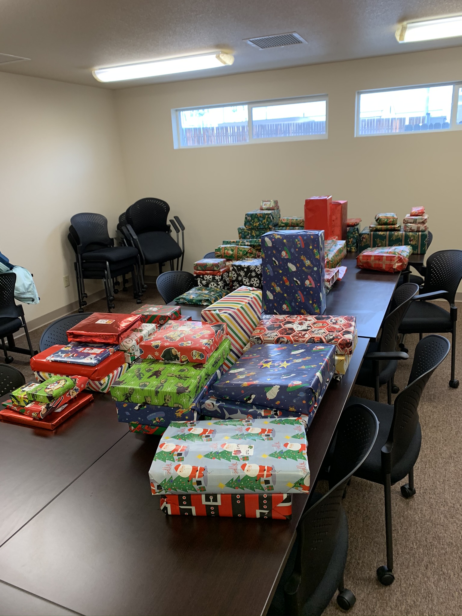 Wrapped Christmas gifts on tables