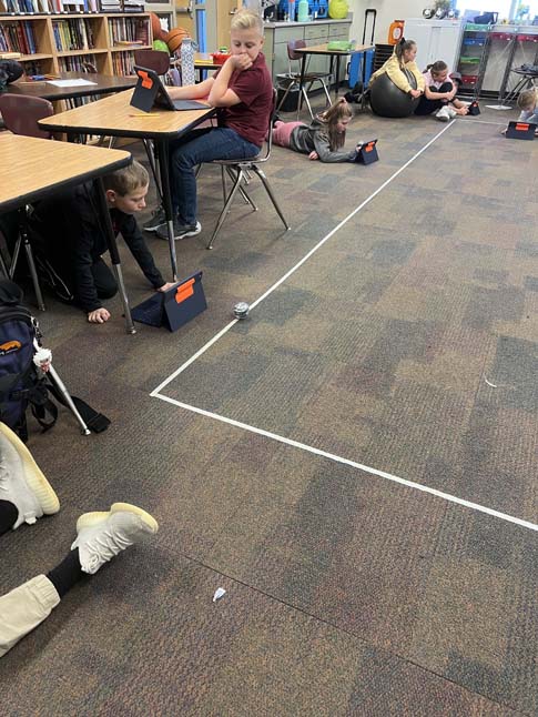 Student working on sphero bolt comprehension activity