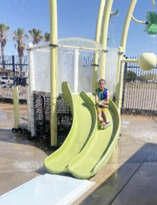 Student enjoying the slide on a playgound