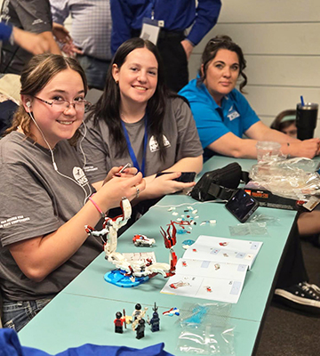 Three women working on a project together