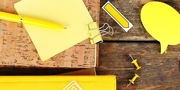 Yellow pen, clips, and caption shape