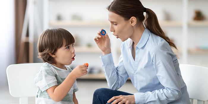 Tutor helping student with sounding out letters