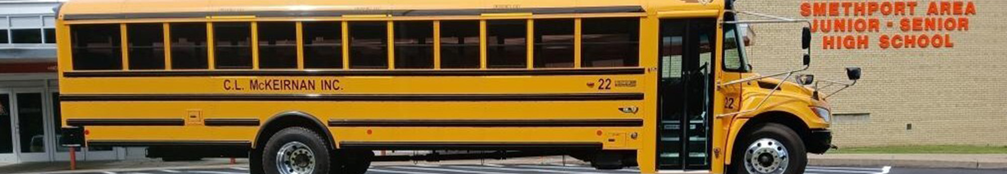 school bus in front of school