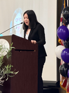 Michiko Francisco speaking at a podium after winning the Youth of the Year Award