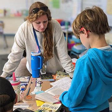 Teacher and student working together