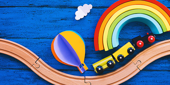Colorful wooden toys on a blue background