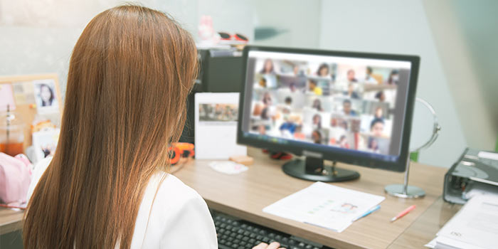 Woman on a computer for a virtual meeting
