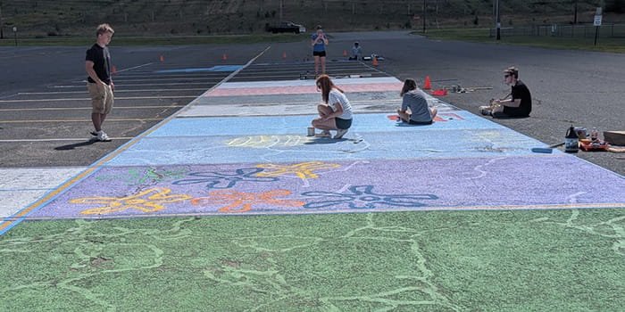 Seniors painting their parking spaces
