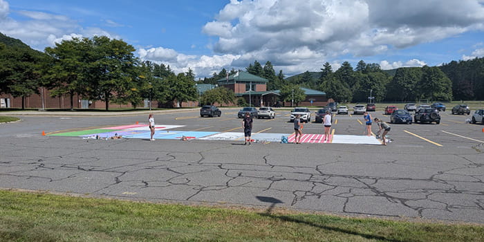 Seniors painting their parking spaces
