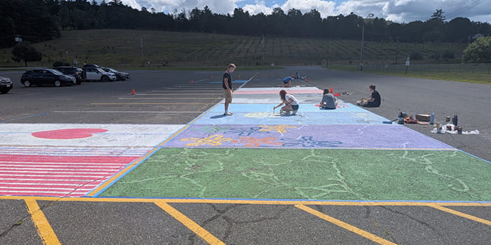 Seniors painting their parking spaces