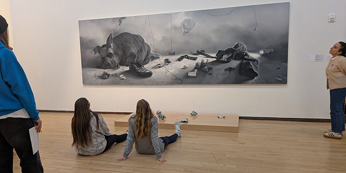 Students viewing a large piece of artwork at MASS MoCA