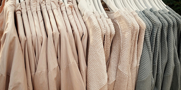 Sweaters and jackets on clothing hangers