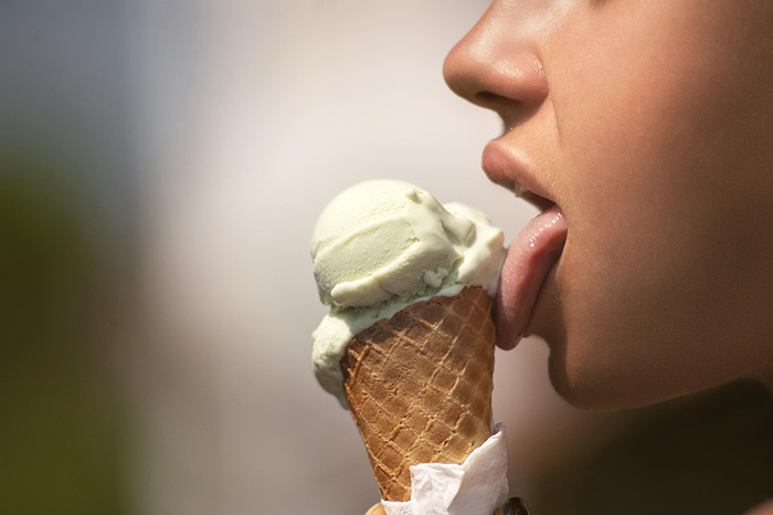 Kid licking and ice cream cone