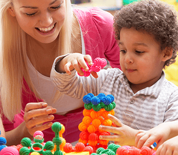 preschool teacher playing with student