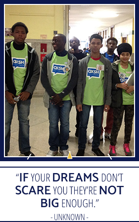 Students in green shirts and "If your dreams don't scare you they're not big enough." - Unknown quote