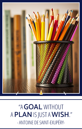Container of pencils with "A goal without a plan is just a wish." - Antoine De Saint-Exupery quote