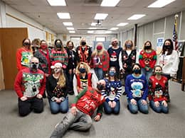 Group staff photo in Christmas sweaters